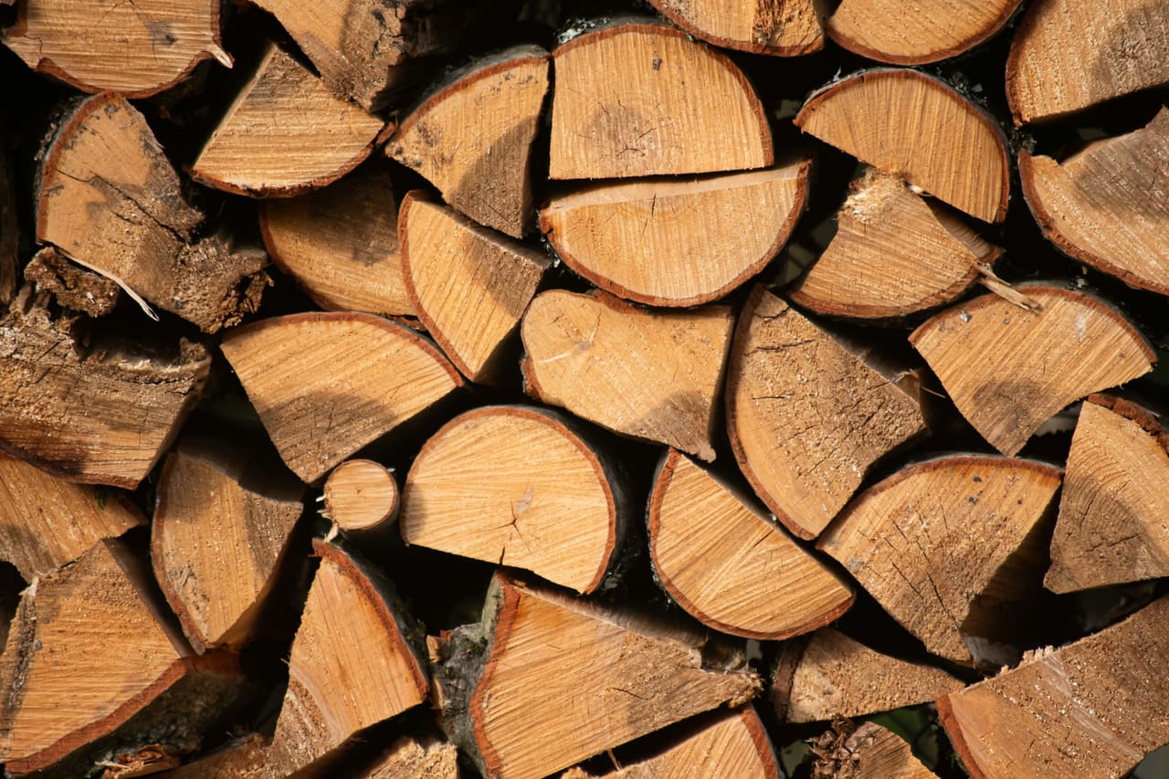 Close-up of a stack of split hardwood logs